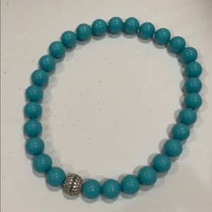 Turquoise beads with rhinestone clasp.